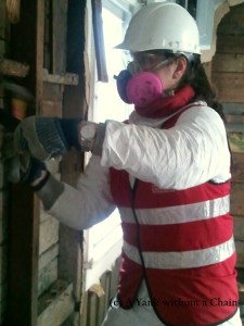 The Yank without a Chain tearing down a mold-infested wall in the Rockaways