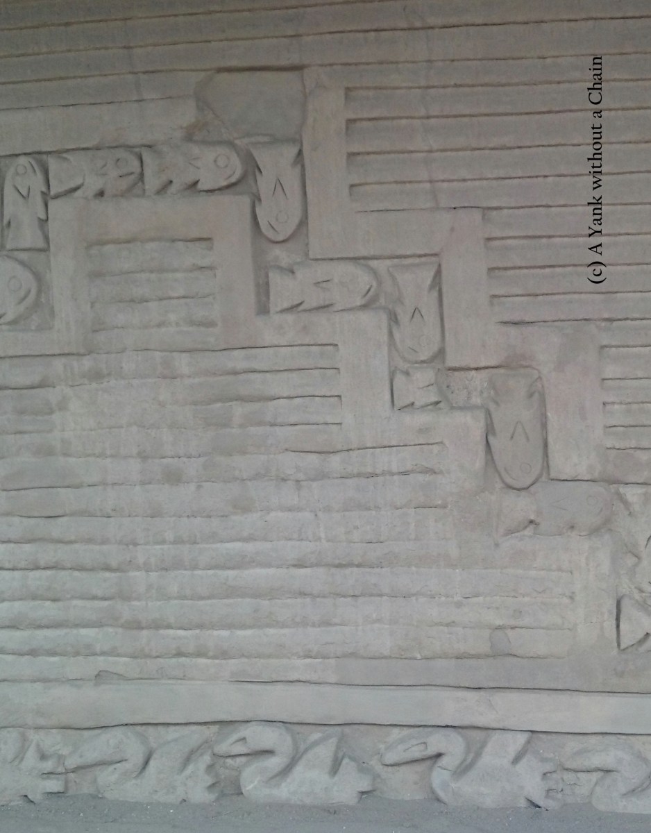 Fish and pelicans carved into the wall at Chan Chan