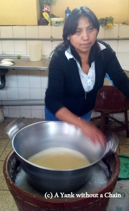 A woman making the traditional queso helado at San Camilo Market