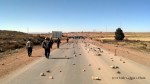The road to Caracollo, on the way to Oruro, is blocked by rocks.