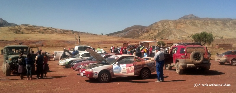 Drivers work on their cars at the conclusion of the nearly 100 km Maragua race
