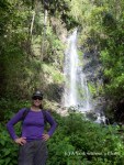 Standing in front of a waterfall, just a short hike from the village of Suri
