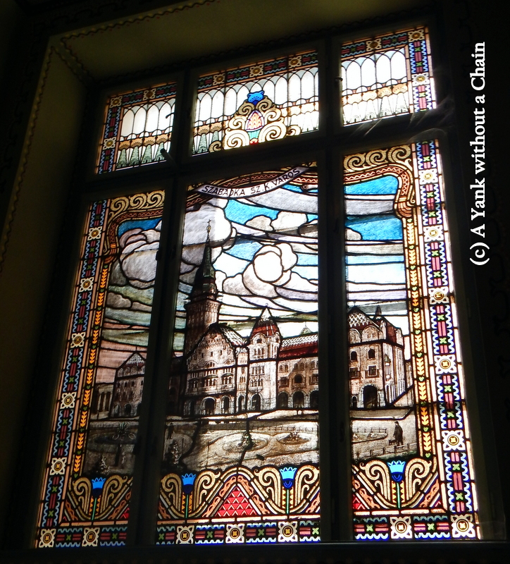 A stained glass inside the city hall representing -- the city hall