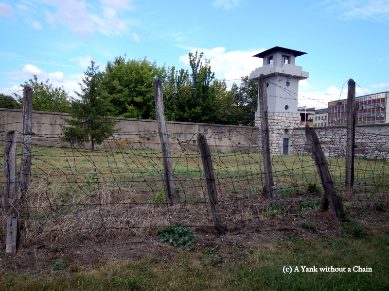 The wall, tower and barbed wire at the Red Cross Concentration Camp