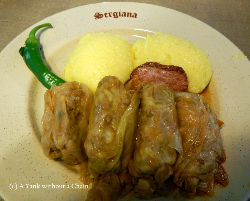 Sarmal - another traditional Romanian dish. It's minced meat and spices wrapped in cabbage leaves, served with thick bacon and polenta. Yum!