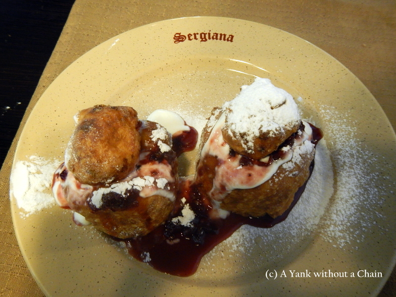 Papanasi, the "must eat" dish in Romania - a type of donut filled with sweet cheese and jam.