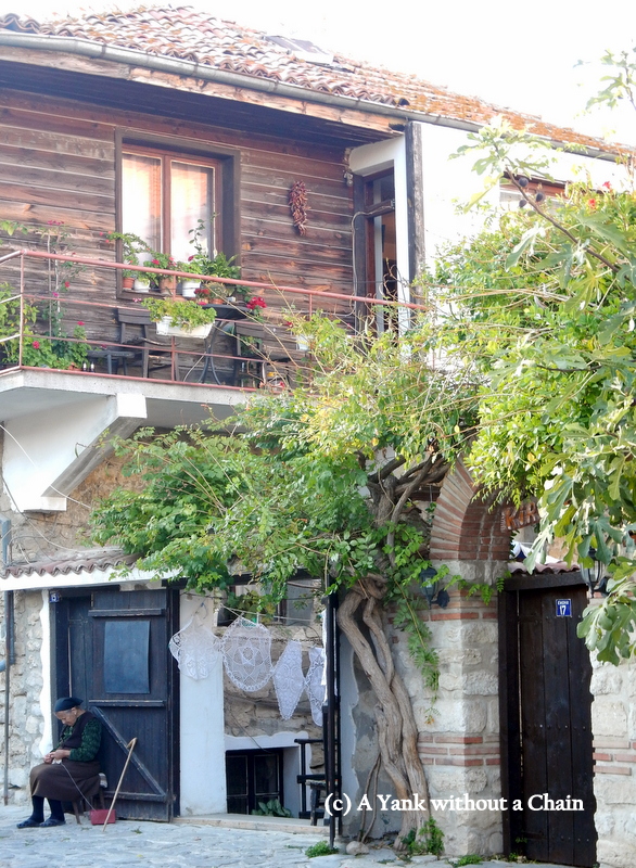 A woman knitting some lace doilies, a common site in Nessebar!