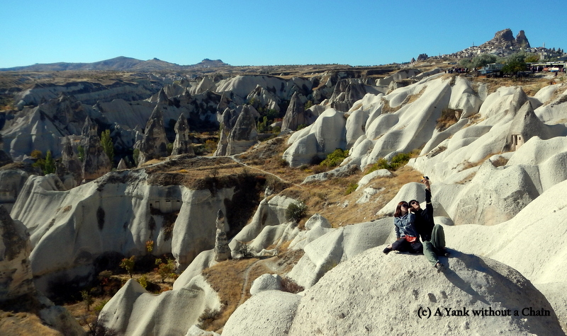 A cute couple trying to capture the perfect selfie