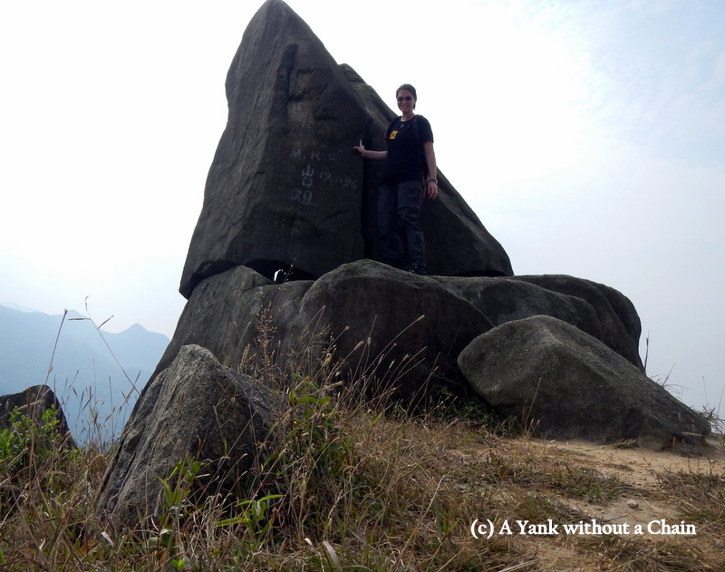 Posing with a rock on the Lo Fu Tau trail