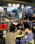 Sitting at a street food stall in central Hong Kong