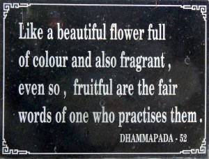 A plaque with a quote from the Dhammapada at Long Son Pagoda