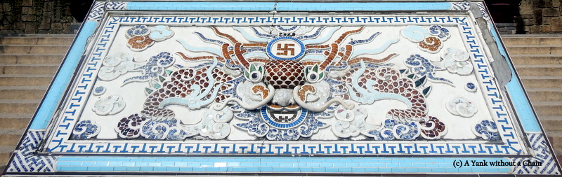 A Buddhist mosaic outside the Long Son Pagoda temple