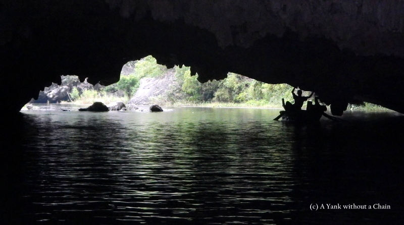 Men in a cave at Tam Coc