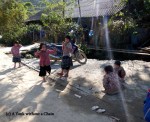 Local girls playing a double dutch-like game