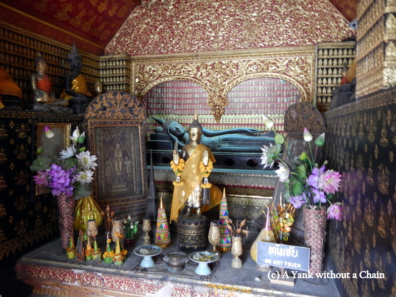 A sleeping Buddha statue at Vat Xieng Thong in Luang Prabang