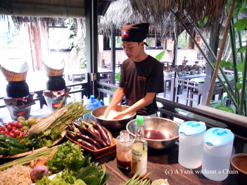 The cooking instructor demonstrating how to clean sticky rice