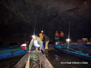 Boarding the boat to begin the trip down the cave
