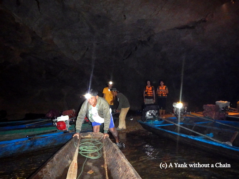 Boarding the boat to begin the trip down the cave