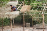 A local man thatching a roof on Don Khon