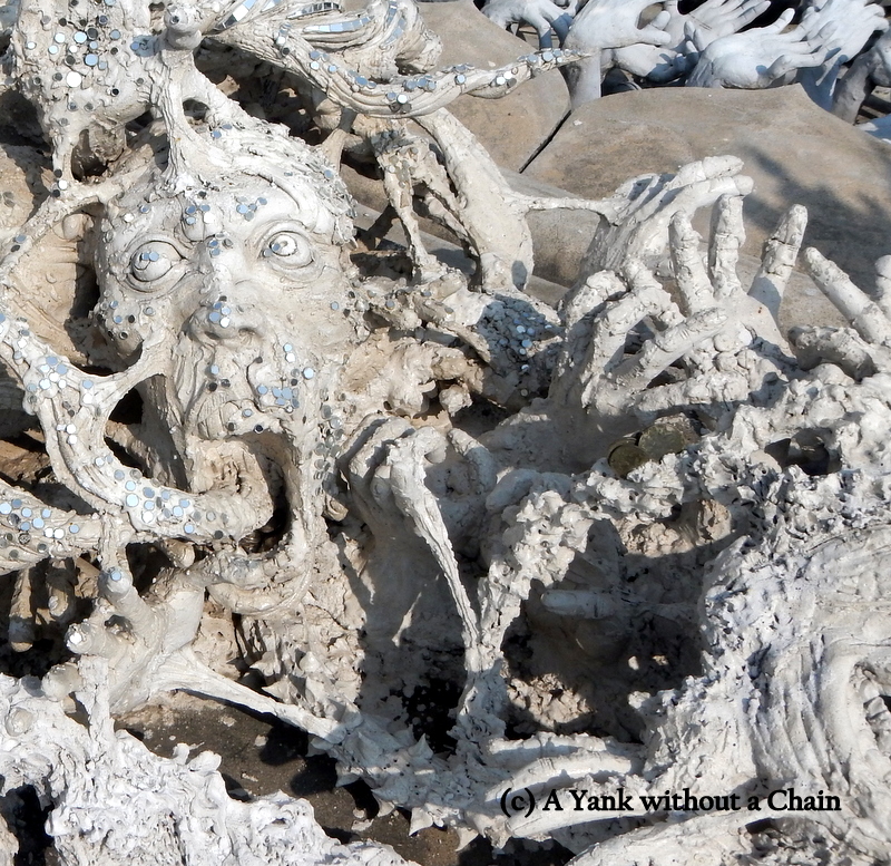 Hellish figures outside the White Temple in Chiang Rai