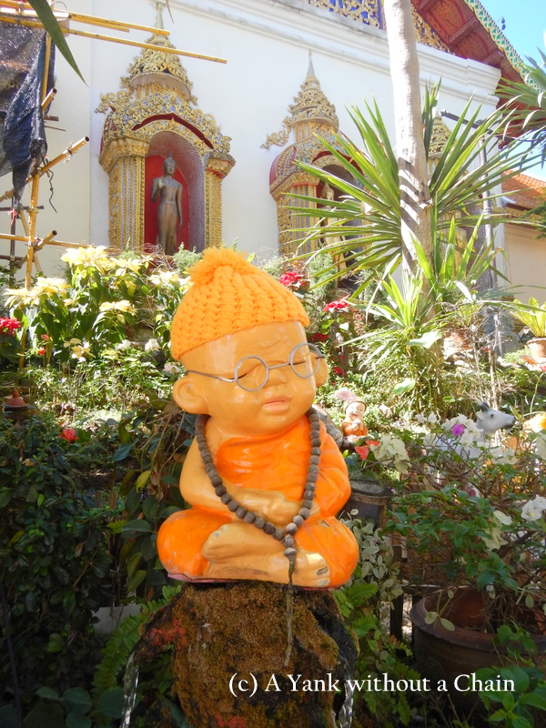 A baby monk statue at Wat Phra That Doi Suthep