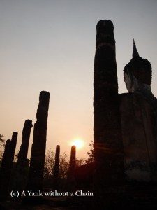 A Buddha statue at Sunrise at Wat Mahathat at Sukothai Historical Park