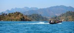 A boat and the cliffs of Chiew Larn Lake