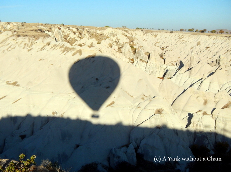 The silhouette of my hot air balloon on the cliffs of Cappadocia