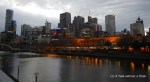 The lights of Flinders Street Station reflecting off the Yarra River