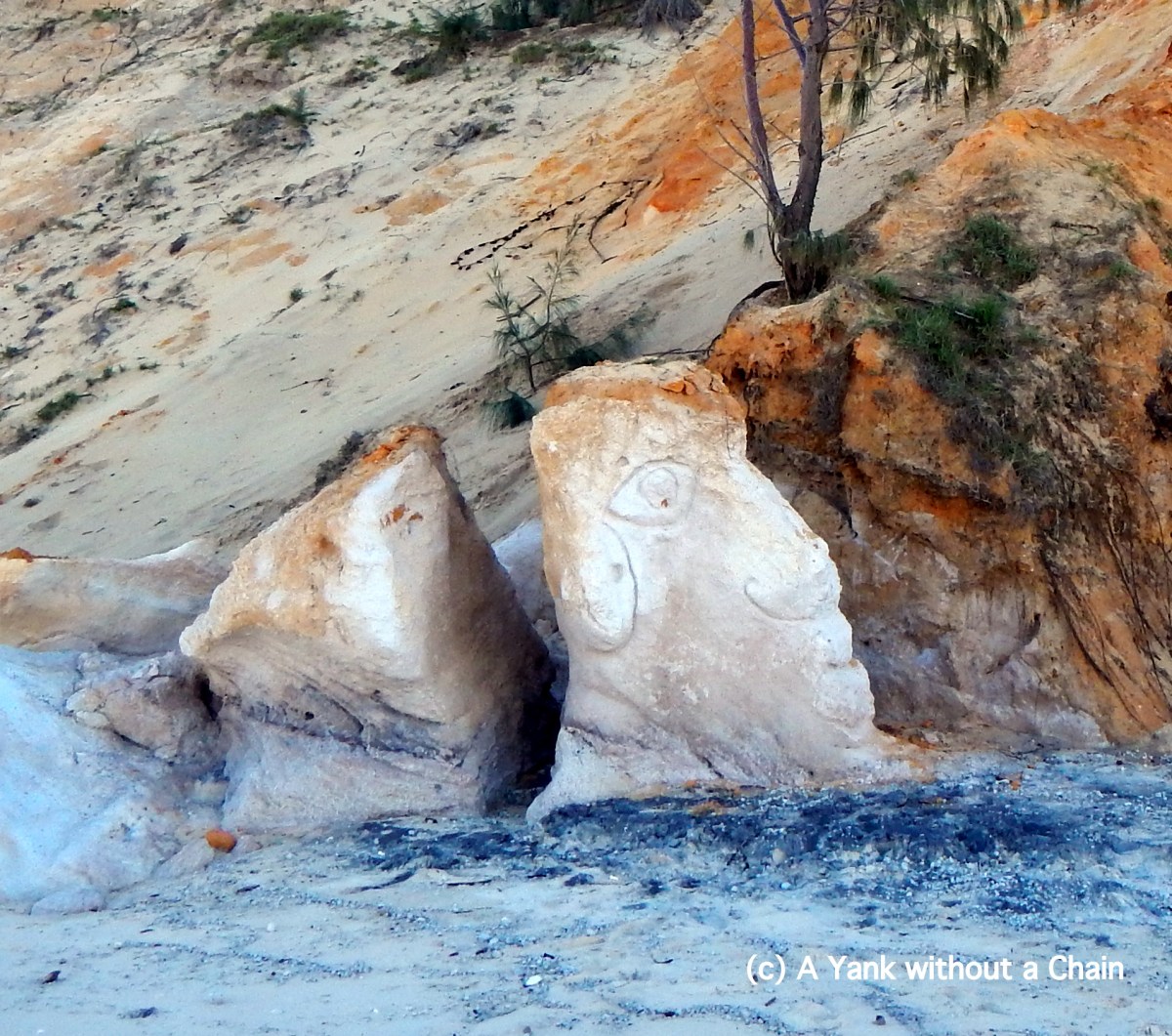 A face carved into the rocks at Rainbow Beach