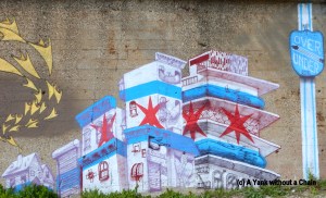 The Chicago city flag represented on a mural in Pilsen